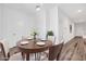 Bright dining area with wood table and four chairs at 5266 Sherwood Forest Ln, Las Vegas, NV 89122