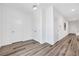 Clean and bright hallway with wood-look flooring at 5266 Sherwood Forest Ln, Las Vegas, NV 89122