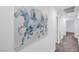 Bright hallway with artwork and access to bedrooms at 5266 Sherwood Forest Ln, Las Vegas, NV 89122