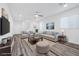 Spacious living room with beige sofas and wood floors at 5266 Sherwood Forest Ln, Las Vegas, NV 89122