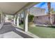 Covered patio, artificial turf, and landscaped yard at 673 Kentons Run Ave, Henderson, NV 89052