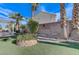 Landscaped backyard with artificial turf and plants at 673 Kentons Run Ave, Henderson, NV 89052