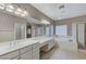 Spa-like bathroom with double vanity, tub and shower at 673 Kentons Run Ave, Henderson, NV 89052