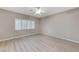 Bedroom with light gray walls, ceiling fan, and wood-look flooring at 673 Kentons Run Ave, Henderson, NV 89052