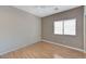 Simple bedroom with wood floors and a window at 673 Kentons Run Ave, Henderson, NV 89052