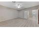 Bedroom with light gray walls, ceiling fan, and wood-look flooring at 673 Kentons Run Ave, Henderson, NV 89052