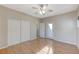 Bright bedroom featuring wood flooring and a private door at 673 Kentons Run Ave, Henderson, NV 89052