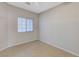 Bright bedroom featuring a window with blinds and neutral decor at 673 Kentons Run Ave, Henderson, NV 89052