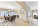 Formal dining area featuring a stylish chandelier and a built-in fireplace at 673 Kentons Run Ave, Henderson, NV 89052