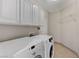 Laundry room with washer, dryer, and cabinets at 673 Kentons Run Ave, Henderson, NV 89052