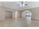 Open living space showcasing tile flooring and arched doorways leading to adjacent areas at 673 Kentons Run Ave, Henderson, NV 89052