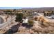 An aerial view of a property featuring mature trees and easy access to the road, perfect for development at 2925 Rice St, Logandale, NV 89021