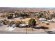 An aerial view showcasing the expansive property, additional structures, and the encompassing mountain views at 2925 Rice St, Logandale, NV 89021