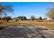 Spacious backyard featuring a concrete patio, open space, and desert landscape at 2925 Rice St, Logandale, NV 89021