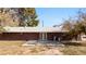 Backyard view of the brick home with a patio, perfect for outdoor entertaining at 2925 Rice St, Logandale, NV 89021