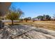 Vast backyard with concrete patio and views of a neighboring property in the distance at 2925 Rice St, Logandale, NV 89021
