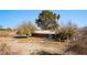 Discover this single-story brick home boasting a mature tree and a quaint patio, perfect for outdoor relaxation at 2925 Rice St, Logandale, NV 89021