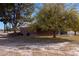 Brick home featuring mature trees and landscaping on a spacious lot at 2925 Rice St, Logandale, NV 89021