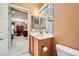 Bathroom featuring a single sink, tiled floors, and a view into the dining room at 7804 Island Rail Dr, North Las Vegas, NV 89084