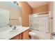 Well-lit bathroom featuring a shower-tub combo and a vanity with good lighting, offering a blend of style and functionality at 7804 Island Rail Dr, North Las Vegas, NV 89084