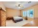 The bedroom features a ceiling fan, natural light, and neutral decor at 7804 Island Rail Dr, North Las Vegas, NV 89084