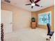 Bright bedroom featuring a ceiling fan, plantation shutters, and a versatile layout at 7804 Island Rail Dr, North Las Vegas, NV 89084