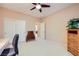 Spacious bedroom featuring a ceiling fan, ample storage, and versatile layout for a relaxing and functional living space at 7804 Island Rail Dr, North Las Vegas, NV 89084
