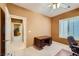 Bedroom with a large window, neutral walls and an open door at 7804 Island Rail Dr, North Las Vegas, NV 89084