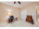 Inviting bedroom with a fan, study space, and closet, perfect for relaxation and productivity at 7804 Island Rail Dr, North Las Vegas, NV 89084