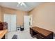 Bedroom with a large window, neutral walls, and a ceiling fan at 7804 Island Rail Dr, North Las Vegas, NV 89084