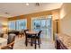 This breakfast nook boasts natural lighting, shutters, and a dining table set at 7804 Island Rail Dr, North Las Vegas, NV 89084