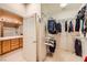 Walk-in closet adjoining the bathroom featuring extensive shelving and hanging space, enhancing storage and organization at 7804 Island Rail Dr, North Las Vegas, NV 89084