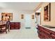 Home entryway featuring tile flooring, neutral walls, and classic wood furniture, creating a welcoming ambiance at 7804 Island Rail Dr, North Las Vegas, NV 89084