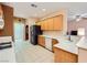 Spacious kitchen featuring bright countertops, wooden cabinets, and modern appliances at 7804 Island Rail Dr, North Las Vegas, NV 89084