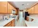 Bright kitchen featuring updated appliances, white countertops, and stylish cabinets at 7804 Island Rail Dr, North Las Vegas, NV 89084