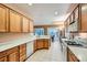 Bright kitchen featuring modern appliances, updated cabinetry, and tile flooring at 7804 Island Rail Dr, North Las Vegas, NV 89084
