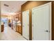 A galley-style kitchen features wood cabinets, white appliances, and tile flooring at 7804 Island Rail Dr, North Las Vegas, NV 89084