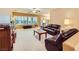 Open-concept living room with large windows, neutral walls, and plush carpet, creating a spacious and airy feel at 7804 Island Rail Dr, North Las Vegas, NV 89084