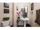 Charming bathroom with pedestal sink and decorative accents at 1004 Crest View Dr, Mesquite, NV 89027