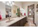 Bright bathroom featuring double sinks and a shower/tub combo at 1004 Crest View Dr, Mesquite, NV 89027
