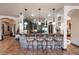 Gourmet kitchen with granite counters, island, stainless steel appliances, and dark wood cabinetry at 1004 Crest View Dr, Mesquite, NV 89027