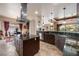 Spacious kitchen boasts granite countertops, large island, and stainless steel appliances at 1004 Crest View Dr, Mesquite, NV 89027