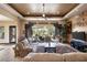 Spacious living room with large windows, fireplace and TV at 1004 Crest View Dr, Mesquite, NV 89027