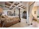 Luxurious Primary bedroom with a king-size bed, and ensuite bathroom access at 1004 Crest View Dr, Mesquite, NV 89027