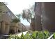 Exterior view of modern townhouses showing well-maintained walkways and lush landscaping at 4490 Rabnor Cir, Las Vegas, NV 89115