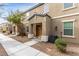 Charming townhome exterior with a landscaped front yard and welcoming entryway at 4490 Rabnor Cir, Las Vegas, NV 89115