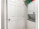 This compact laundry area features a stacked washer and dryer for convenient in-home laundry at 4490 Rabnor Cir, Las Vegas, NV 89115