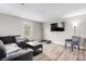 Comfortable living room boasts plank flooring and a cozy gray sofa, creating a relaxing atmosphere at 4490 Rabnor Cir, Las Vegas, NV 89115