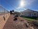 This backyard features a mix of desert landscaping and artificial turf putting green at 2710 Mustang Pass St, Laughlin, NV 89029