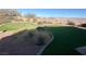 This backyard showcases artificial turf and desert landscaping, perfect for outdoor enjoyment at 2710 Mustang Pass St, Laughlin, NV 89029